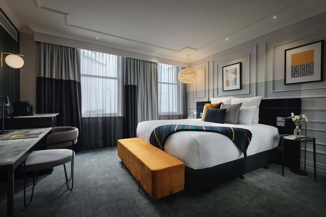 Superior King room featuring beautiful furnishings, a premium king-size bed, and décor